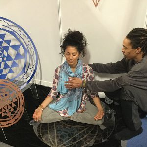 Om Yoga Show in Manchester 2018 Lee healing a yoga instructor on Universal DNA